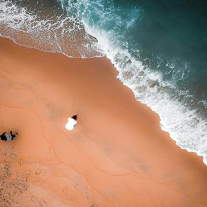 Gentle waves lapping on a sandy shore.